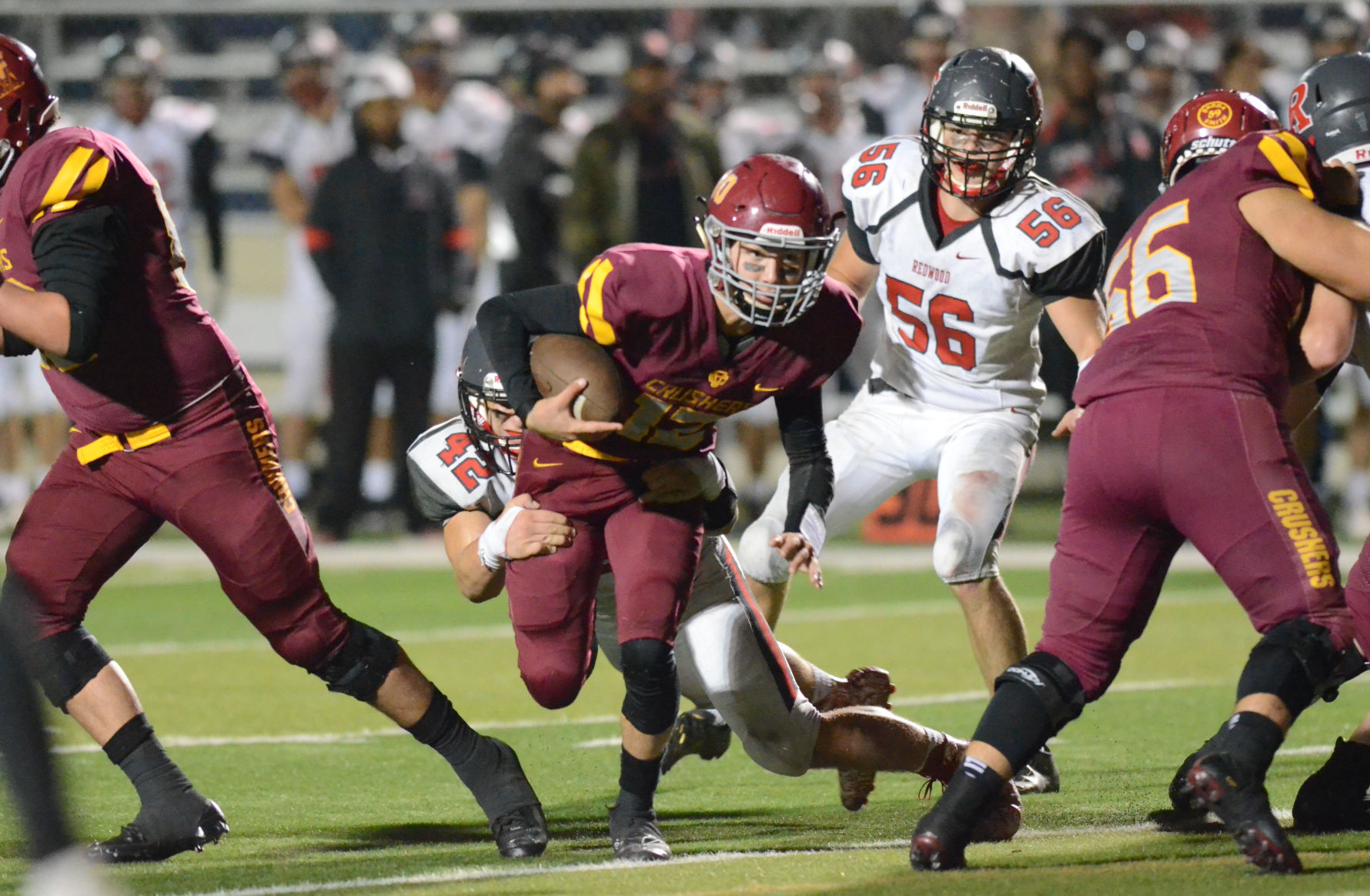 Vintage football vs. Redwood